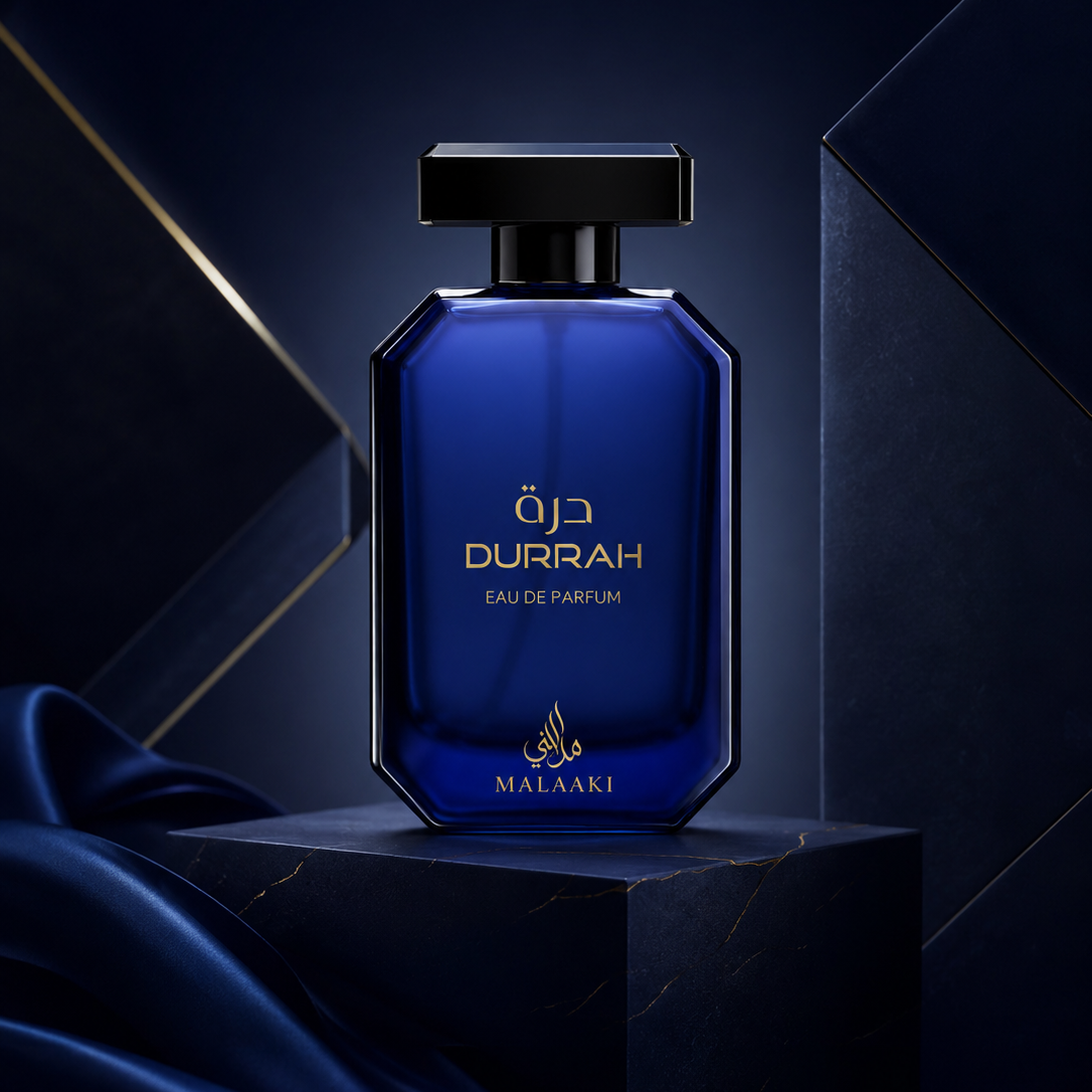 Blue perfume bottle labeled 'Durrah' on a dark background